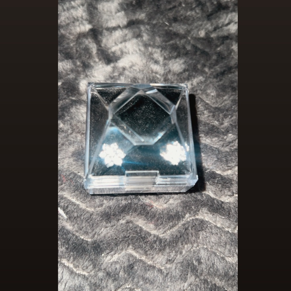 Silver earrings from Clinton’s jewelers (flower shape)